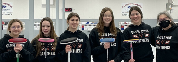 a photo of 5 curlers and their coach