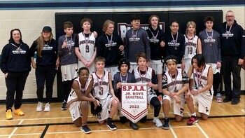 photo of boys basketball team holding SPAA Jr. Boys Basketball Champions banner from 2022