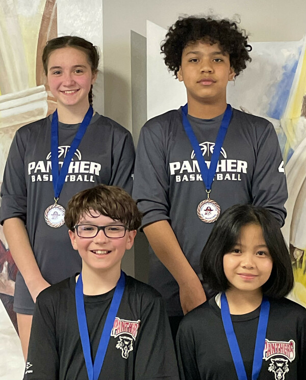 a photo of 4 badminton players wearing medals